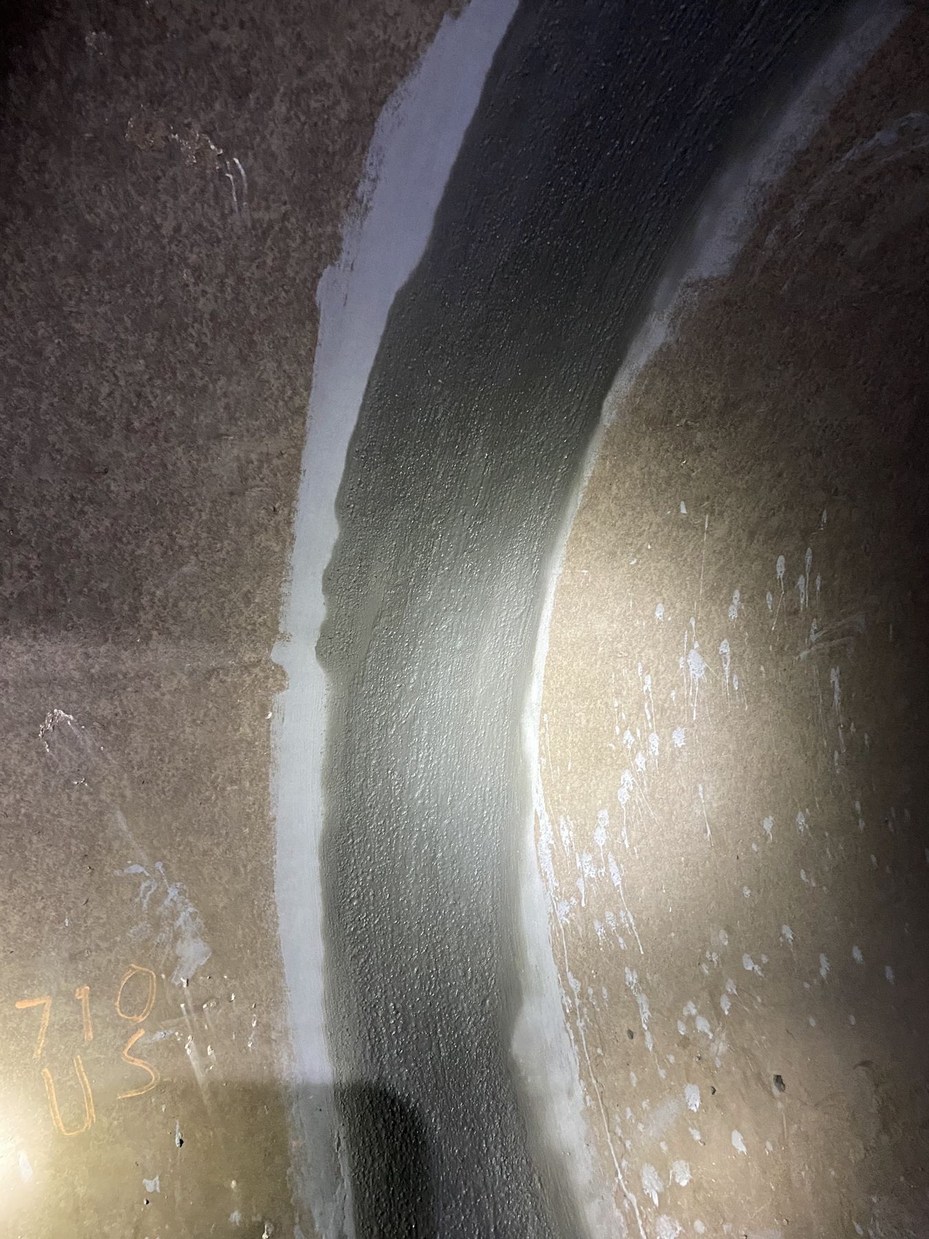Sealant along an interior joint in a concrete structure